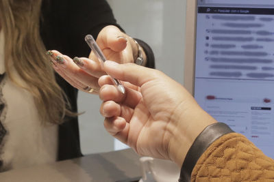 Close-up of woman holding hands