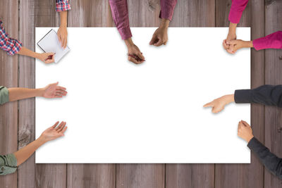 Cropped image of business colleagues having meeting on conference table in office