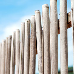 Close-up of wooden fence against sky