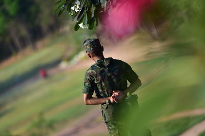 Full length of man standing on plant