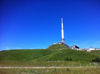 View of landscape against clear blue sky