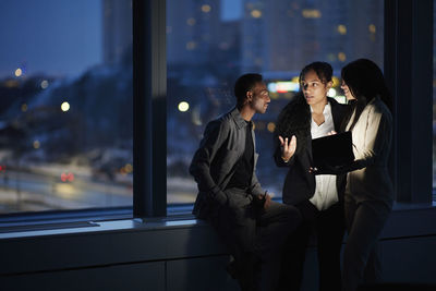 Colleagues working late in office