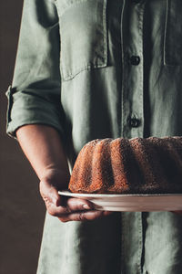 Midsection of man preparing food