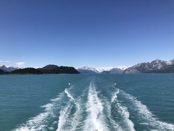 Scenic view of sea against clear blue sky