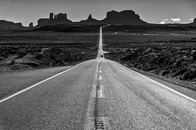 Empty road along landscape