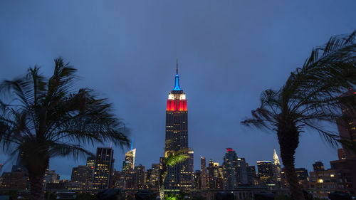 View of skyscrapers lit up at night