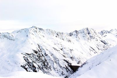 Aerial view of snowcapped mountain against sky