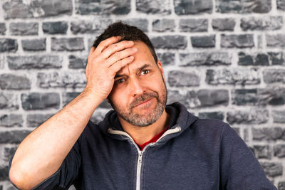 Portrait of man against wall