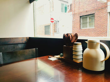 Coffee cup on table by window