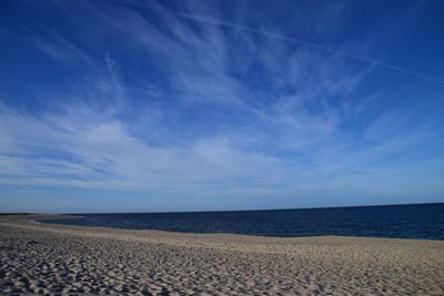 Scenic view of sea against blue sky
