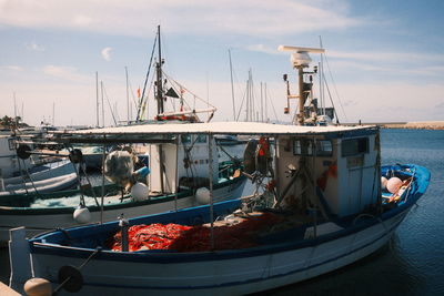 Boats moored at harbor