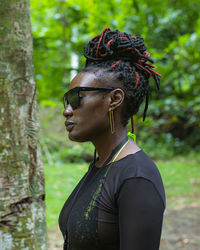 Portrait of young woman standing outdoors