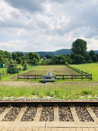 Train on railroad track against sky