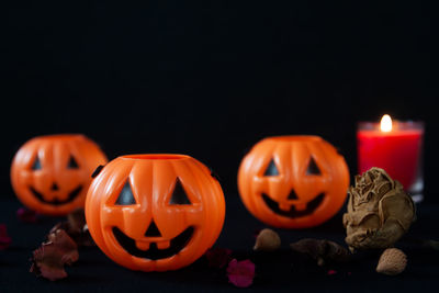 Close-up of illuminated pumpkin against black background