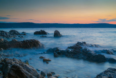Scenic view of sea at sunset