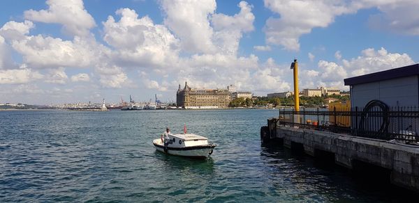 Panoramic view of sea and buildings against sky