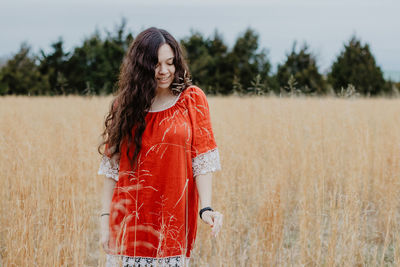 Young woman standing on field