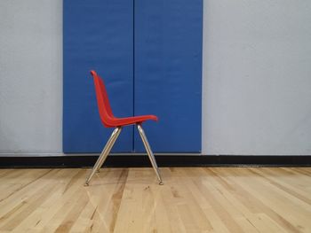 Close-up of chair on hardwood floor