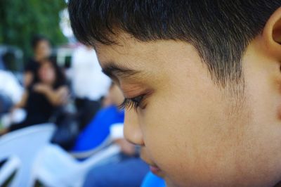 Close-up of boy at outdoor cafe