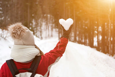 Woman on snow covered landscape