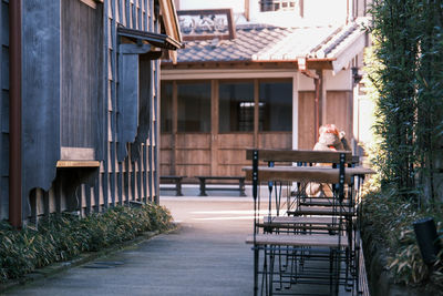 Empty chairs and tables in yard