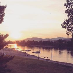 Scenic view of lake at sunset