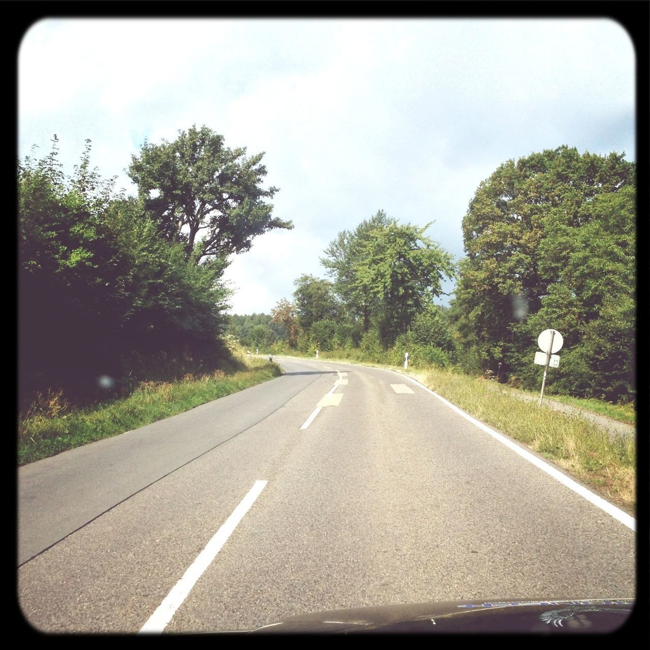 transportation, road, the way forward, road marking, tree, diminishing perspective, vanishing point, transfer print, sky, country road, asphalt, street, empty, empty road, auto post production filter, day, car, road sign, double yellow line, no people