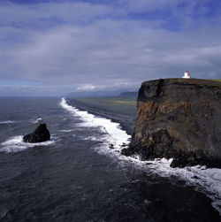 The lighthouse at dyrhólaey cliff in the south of iceland