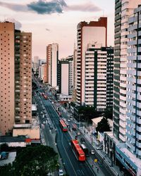 High angle view of city street and buildings against sky