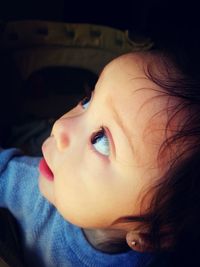 High angle view of baby girl looking up while in stroller