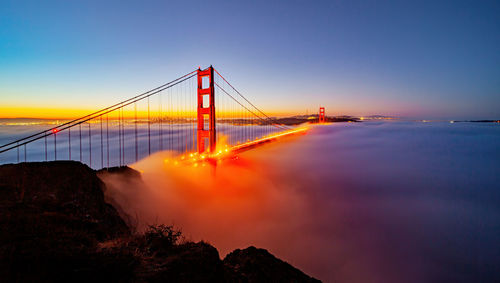 Golden gate bridge with low fog in the morning