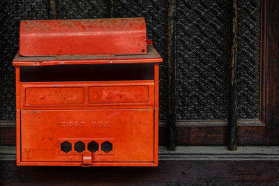 Red mailbox on window