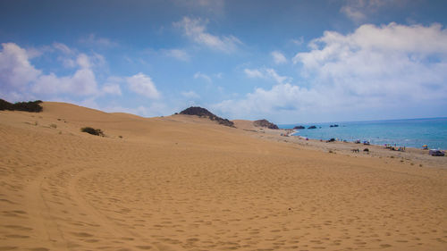 Scenic view of beach against sky