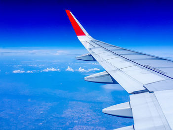 Airplane flying over blue sky