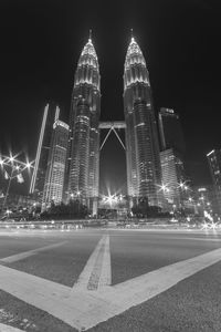 Illuminated city buildings at night