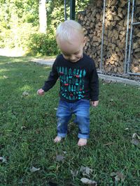 Full length of boy standing on grass