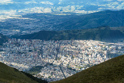 Aerial view of buildings and mountains in city