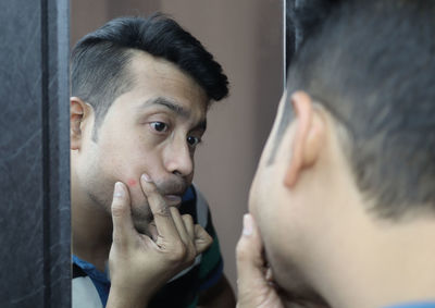 Close-up of man looking at camera