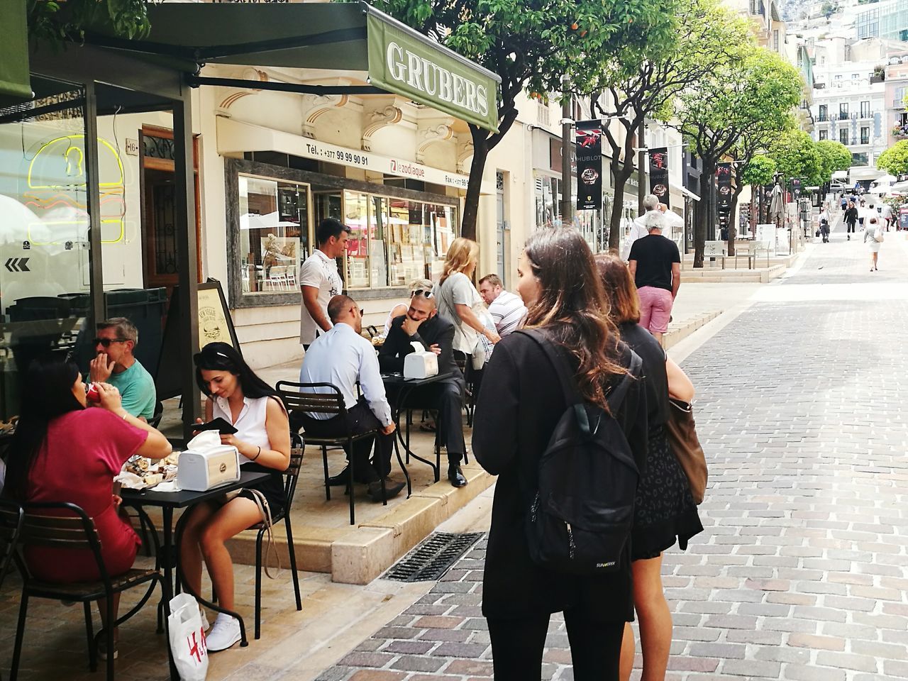 PEOPLE IN FRONT OF CITY