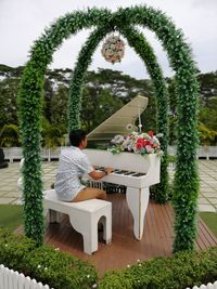 Man playing piano in park