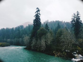 Scenic view of waterfall against sky