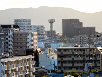 High angle view of buildings in city against sky