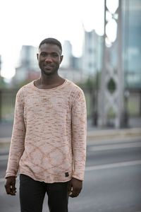 Portrait of young man standing outdoors