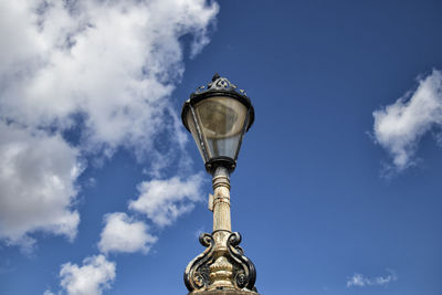 Low angle view of street light against sky