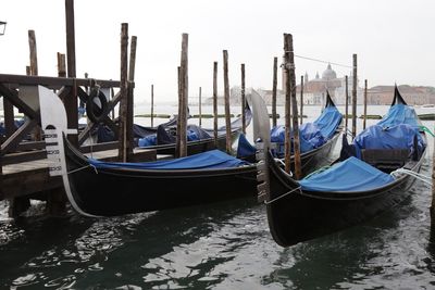 Boats moored in water