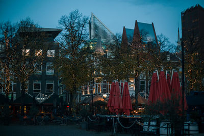 Low angle view of buildings in city at night