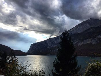 Scenic view of lake and mountains against sky