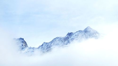 Scenic view of snow mountains against sky