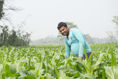 Young man standing in field