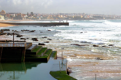 View of sea against sky in city